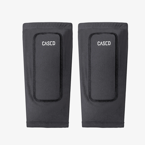 Cased low-profile shin protection for skiing is designed to eliminate shin pain and keep you comfortable all day.